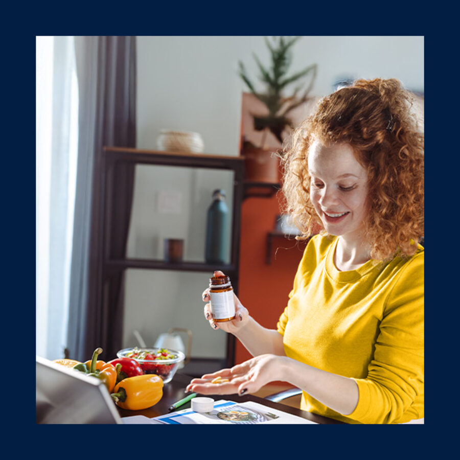 woman sat at table with laptop